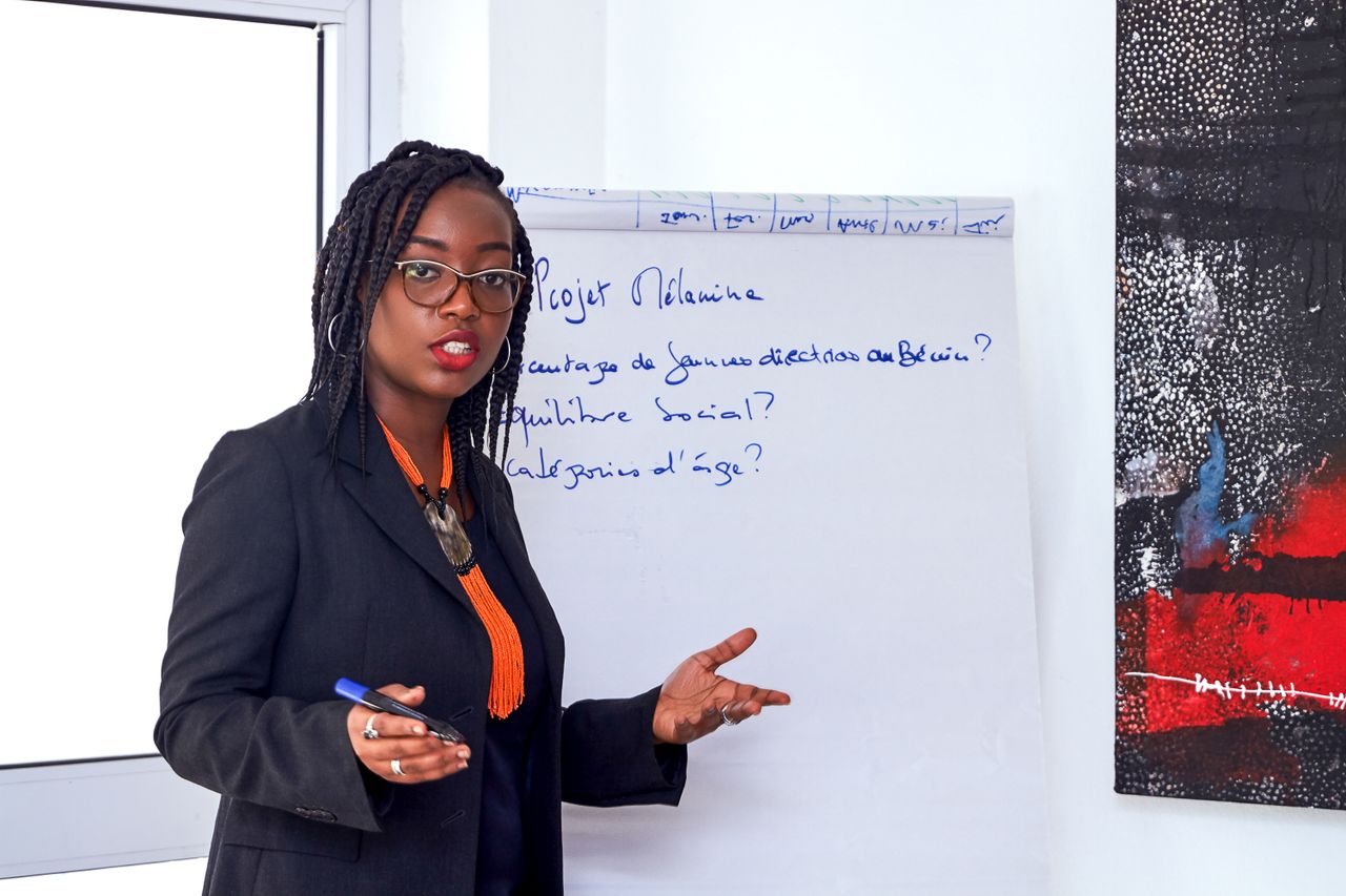 African American businesswoman analyzing data during an office presentation.