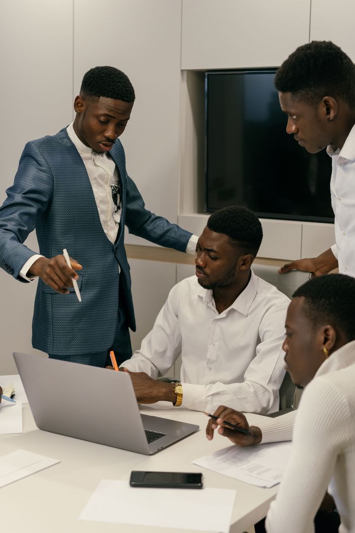 Crafting Captivating Headlines: Your awesome post title goes here A diverse team engaged in a productive meeting in a modern office environment.